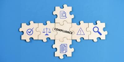 puzzle pieces with a compliance theme